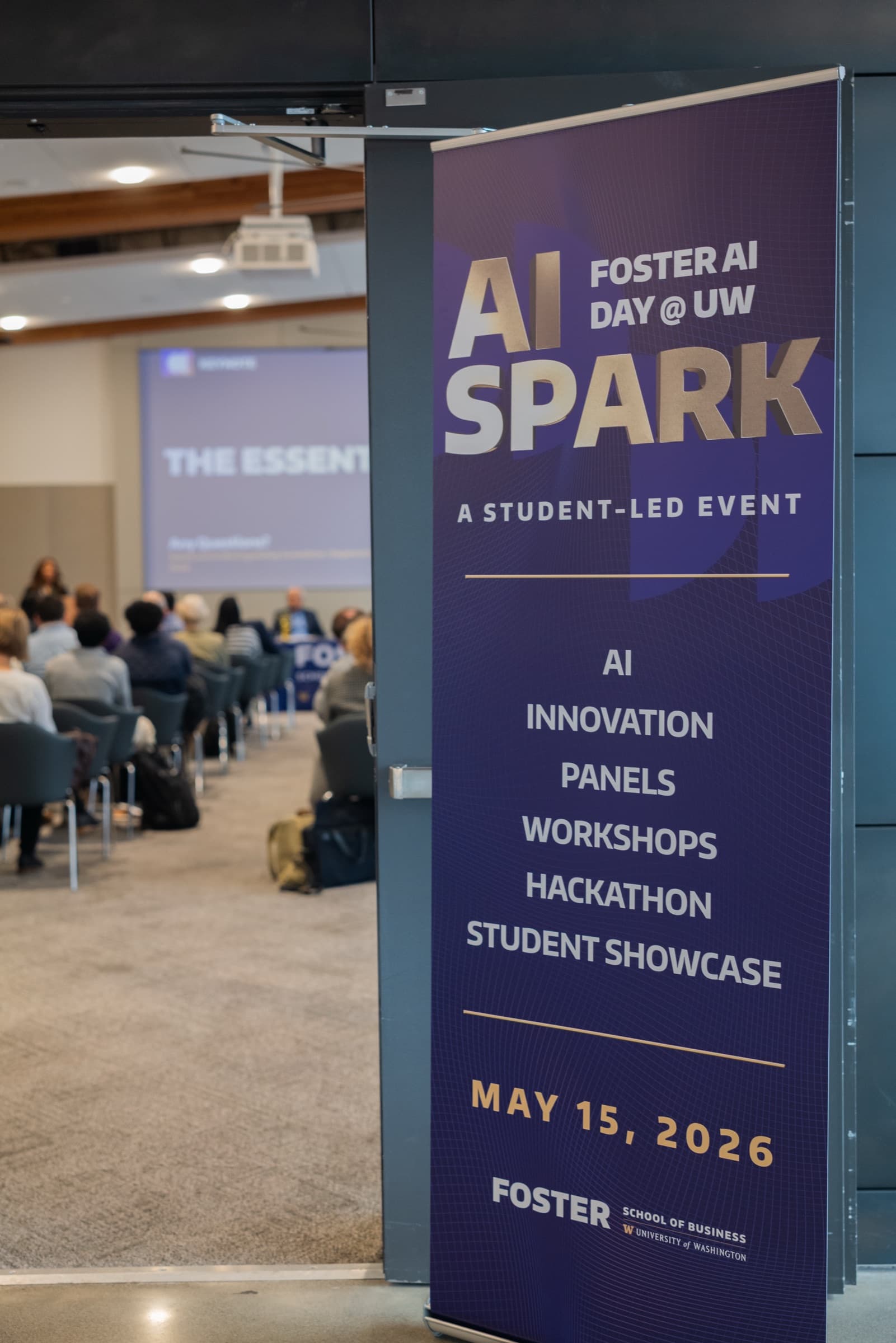 AI Spark event banner outside a room with an audience.