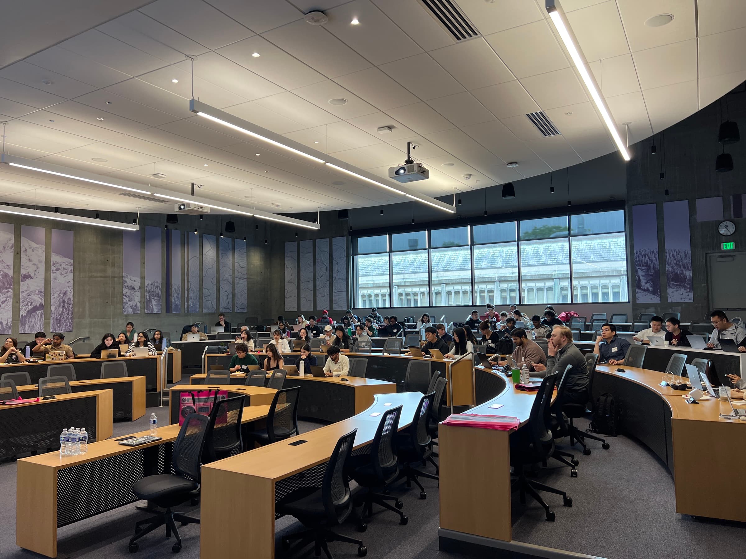 Hackathon participants gathered with laptops in the Founders Hall classroom.