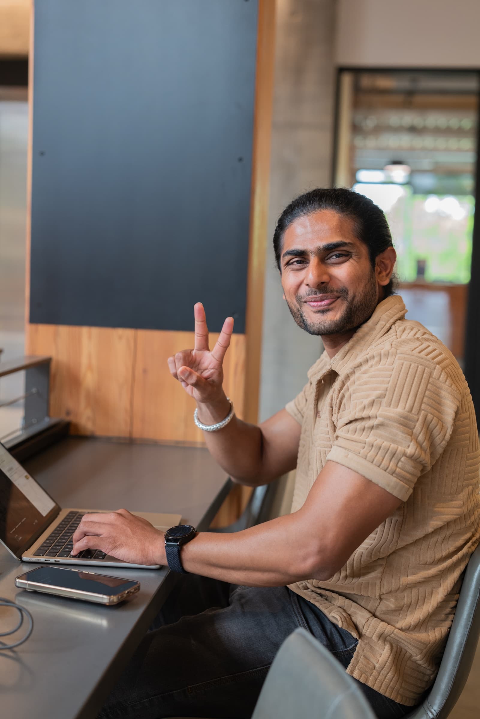 An AI Spark participant seated at a laptop.