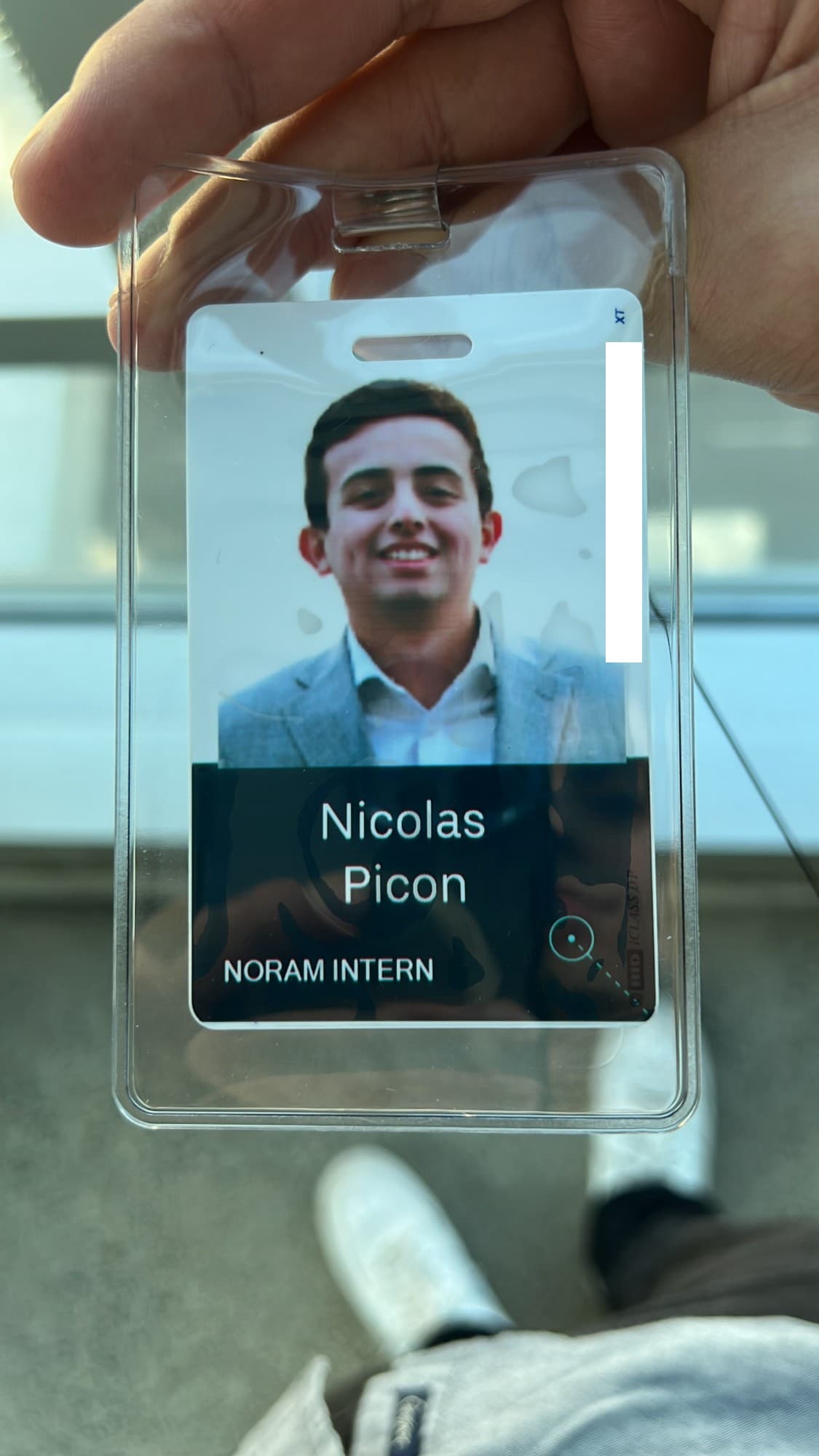 Nicolas holding his Uber NORAM intern badge.