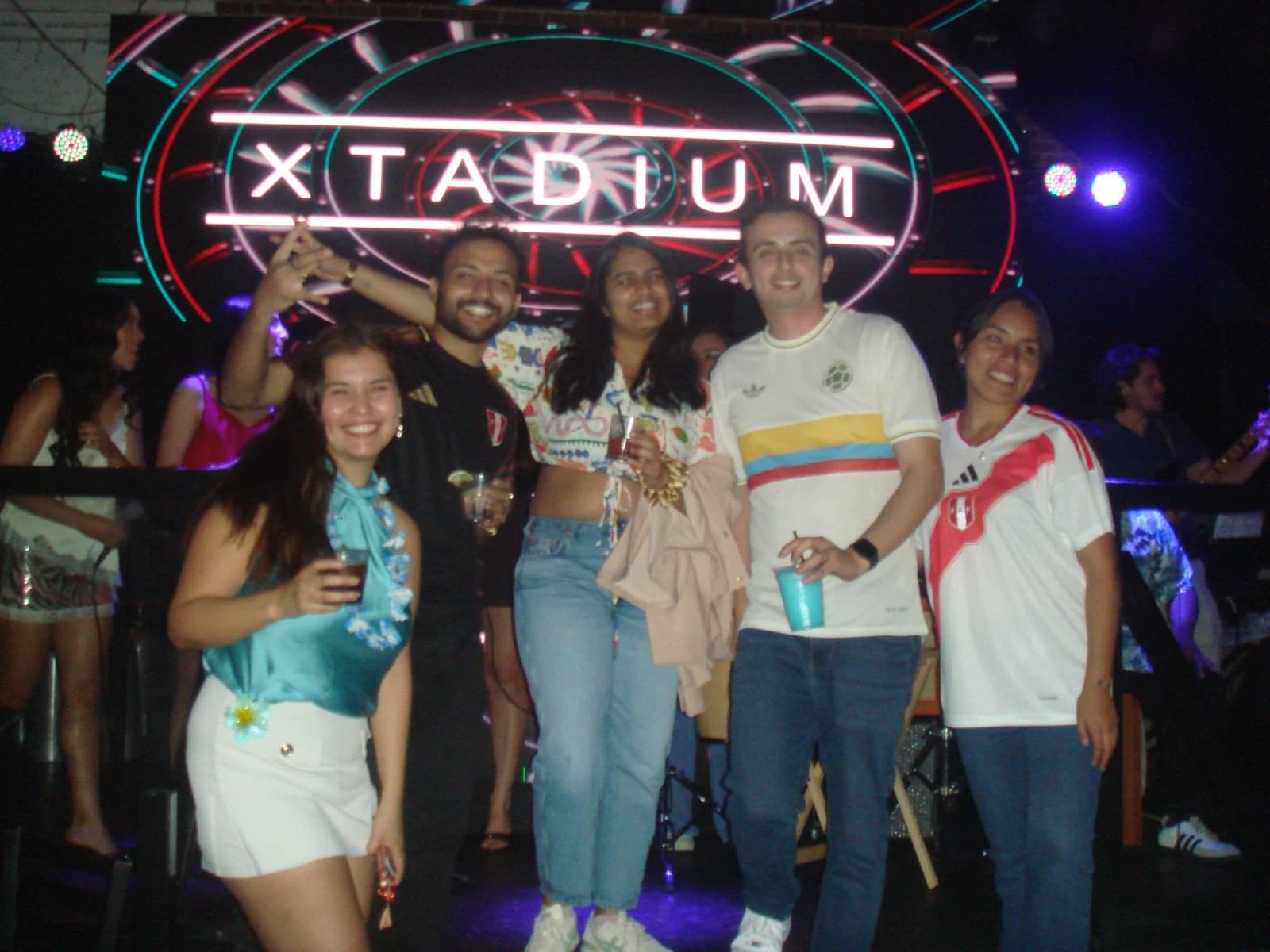 A group of classmates in Latin American football shirts at Latin Carnival.